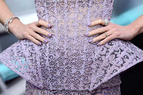 Emily Blunt wears lilac nail polish with a matching dress.