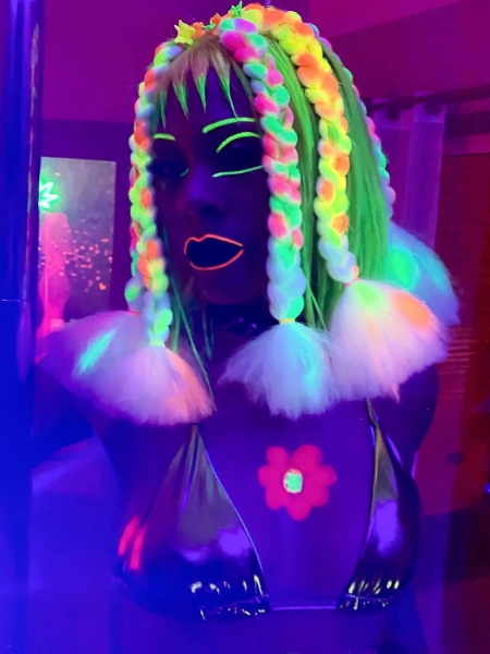 Rapper Rico Nasty as KC in Margo's Got Money Troubles wearing glowinthedark makeup and wig